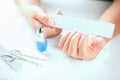 woman polishing her nails Royalty Free Stock Photo