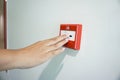 Hand of woman pulling fire alarm switch Royalty Free Stock Photo