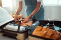 Hand, woman and suitcase for travel, adventure and holiday on a bed before leaving for vacation. Hands, girl and luggage Royalty Free Stock Photo