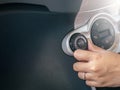 Hand of woman turning on car air conditioning system,Button on dashboard in car Royalty Free Stock Photo