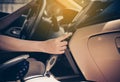 Hand woman turning on car air conditioning system,Finger turn on air button,Button on dashboard in car panel Royalty Free Stock Photo