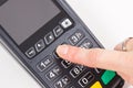 Hand of woman using credit card reader to enter PIN code. Cashless paying. Finance and banking Royalty Free Stock Photo