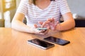 Hand woman using mobile phone,social media,relaxed girl checking cell phone at canteen