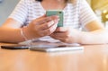 Hand woman using mobile phone,social media,relaxed girl checking cell phone at coffee shop,Connection wifi Royalty Free Stock Photo