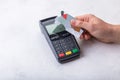 Hand of woman using payment terminal, paying with credit card, credit card reader Royalty Free Stock Photo