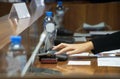 Hand of a woman voting during a political meeting. Parliamentary lawmaking Royalty Free Stock Photo