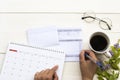 Hand of woman working with saving account passbook bank ,statement due expenses Royalty Free Stock Photo