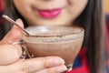 Hand women with cappuccino coffee in a cup of coffee Royalty Free Stock Photo