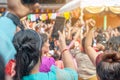 Hand women holding smart phone mobile shooting burmese people dress in national costumes, Come out to participate and dance in the