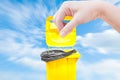 Hand women Pick catch , yellow Garbage bins on blue sky