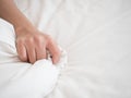 Hand of women pulling white sheets