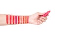 Hand women showing swatch color lipstick
