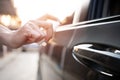 Hand women use Alcohol spray clean hand opening the car door protection and cleaning concept of transportation Royalty Free Stock Photo