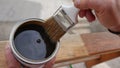 hand of wood professional painting with impregnating agent, for wood a brown Royalty Free Stock Photo