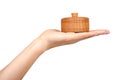 Hand with wooden container, round case. Isolated background Royalty Free Stock Photo