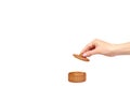 Hand with wooden container, round case. Isolated background