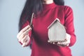 Hand wooden house model with key Royalty Free Stock Photo