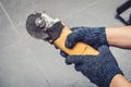 Hand of worker man hold Grinder blades broken . Dangers of using Royalty Free Stock Photo