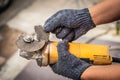 Hand of worker man hold Grinder blades broken . Dangers of using Royalty Free Stock Photo