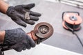 Hand of worker man hold Grinder blades broken . Dangers of using Royalty Free Stock Photo