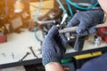 Hand of worker man holding Electric drilling machine on wooden with Drill Press machine . selective focus Royalty Free Stock Photo