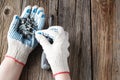 Hand of the worker screws in a wooden block with a screwdriver Royalty Free Stock Photo