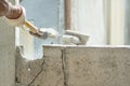 Hand of worker using hammer smashing and demolish on brick wall at construction site Royalty Free Stock Photo