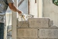 Hand of worker using hammer smashing and demolish on brick wall at construction site Royalty Free Stock Photo