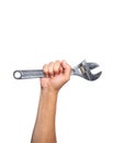 Hand of a worker with a wrench on a white background, symbol of labor day