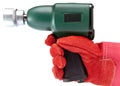 Hand in a working glove holds air impact wrench on a white background Royalty Free Stock Photo