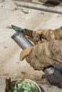 Hand of a workman filling grease gun