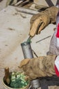 Hand of a workman filling grease gun Royalty Free Stock Photo