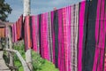 Hand woven clothes hang on wooden walkways in rice field at Sila Laeng, Pua District, Nan Royalty Free Stock Photo