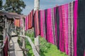 Hand woven clothes hang on wooden walkways in rice field at Sila Laeng, Pua District, Nan Royalty Free Stock Photo