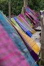 Hand woven clothes hang on wooden walkways in rice field at Sila Laeng, Pua District, Nan, Thailand Royalty Free Stock Photo