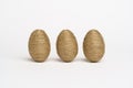 Hand wrapped easter eggs with jute twine, isolated white background