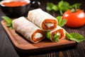 hand wraps mozzarella stick in spring roll sheet