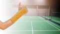 hand with wrist support on background badminton indoor court, sp Royalty Free Stock Photo