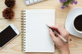 Hand write on notebook on wood working desk