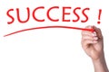 Hand writes word success with red marker Royalty Free Stock Photo