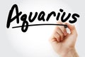 Hand writing Aquarius with marker