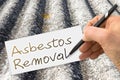 Hand writing Asbestos Removal with a pencil on a sheet - concept image Royalty Free Stock Photo