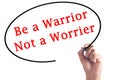 Hand writing Be a Warrior Not a Worrier on transparent board