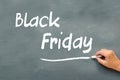 Hand writing Black Friday with chalk on a chalkboard Royalty Free Stock Photo