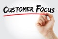 Hand writing Customer Focus with marker, concept background Royalty Free Stock Photo