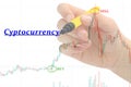 Hand writing `Cyptocurrency` on business graph and stock financial indicator.