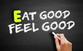 Hand writing Eat Good Feel Good on blackboard, health concept background