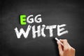 Hand writing Egg white on blackboard, concept background Royalty Free Stock Photo