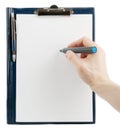 Hand writing on an empty document in a clipboard Royalty Free Stock Photo