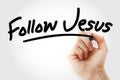 Hand writing Follow Jesus text with marker